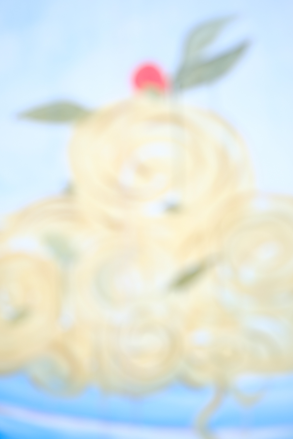 Abstract artwork featuring soft cream and pale yellow tones with a red circular form at the top and green leaf-like shapes against a light blue background
